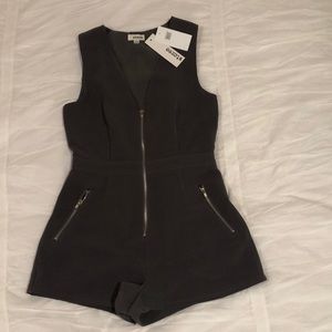 Army green romper that can be dressed up or down.